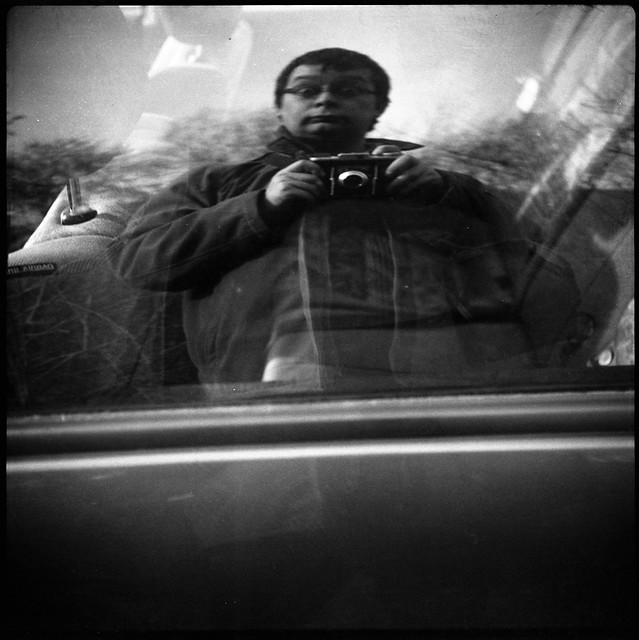 the high art of self portraiture in the window of a parking car (2)