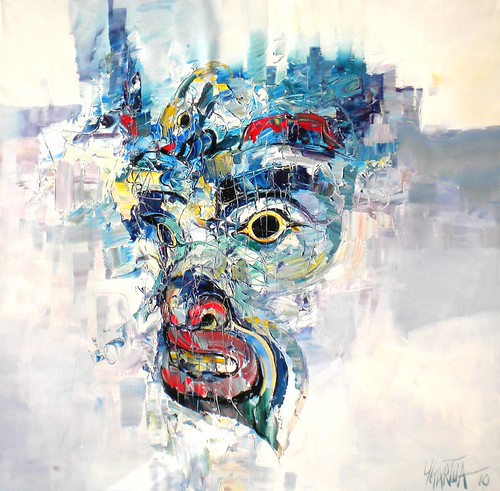 Mask face emerging from blue and white textured paint