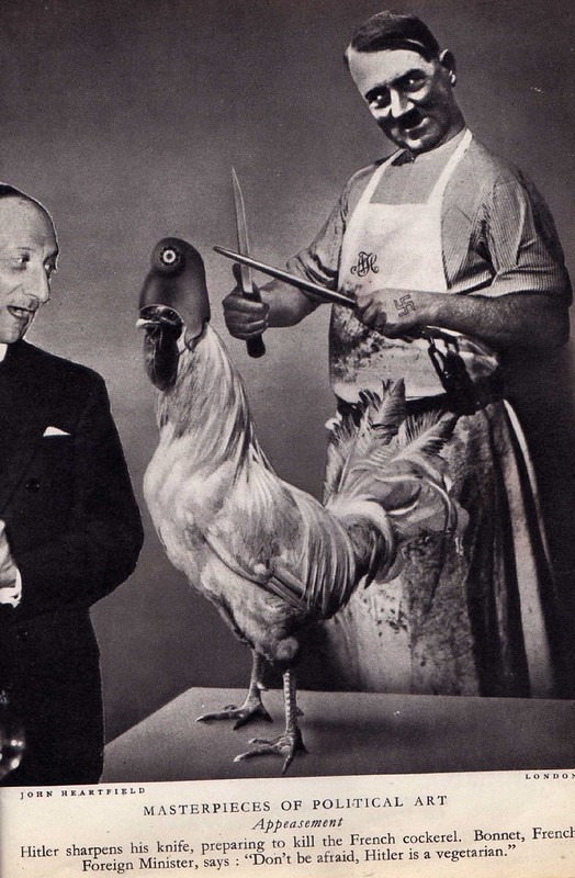 Hitler about to eat the French Cockerel.