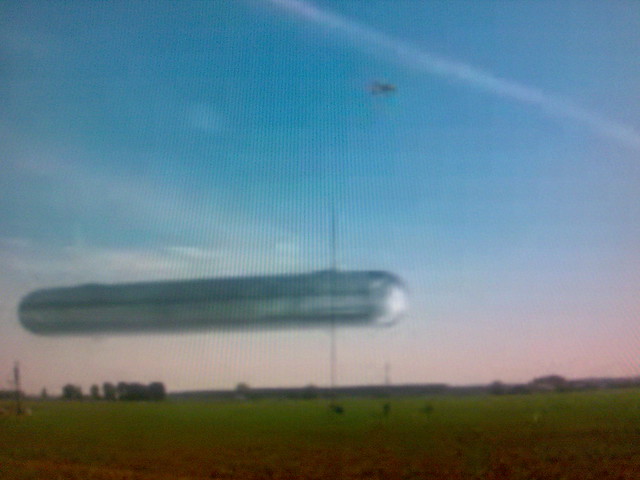 Huge cigar ufo at airfield