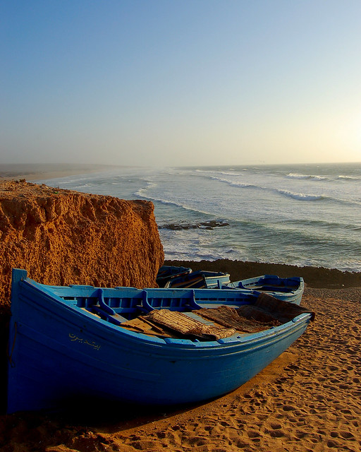 Blue boats above Morocco's Sidi Jonas beach