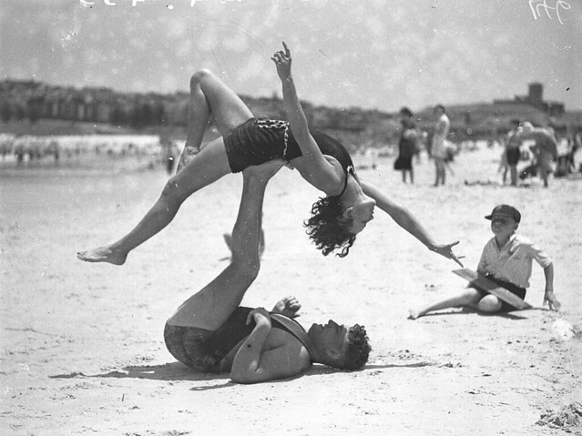 Mr J Prentice and Miss J Howat doing acrobatics, Bondi Beach, Jan 1935 / by Ted Hood