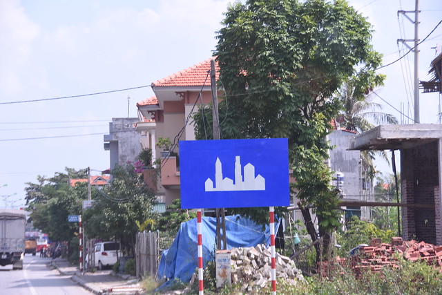Typical Vietnamese sign while entering town limits