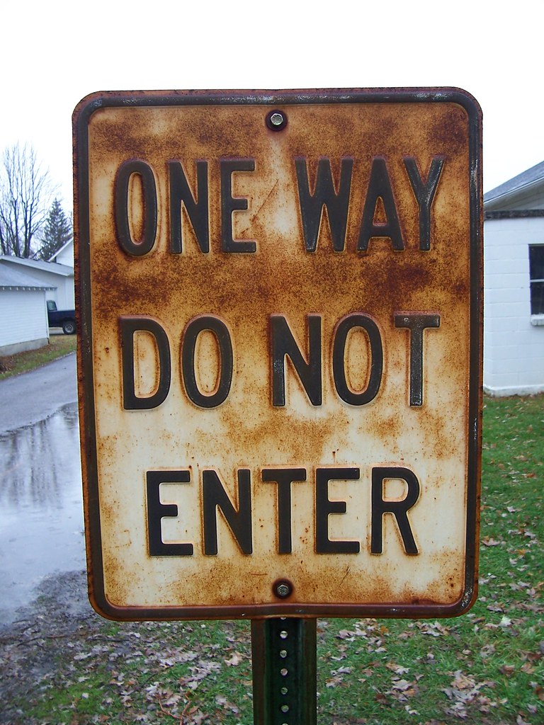 A rusty sign saying "One Way Do Not Enter" in Ashley, Ohi...