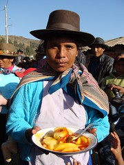 Woman serving us lunch at celebration in Huyuculano