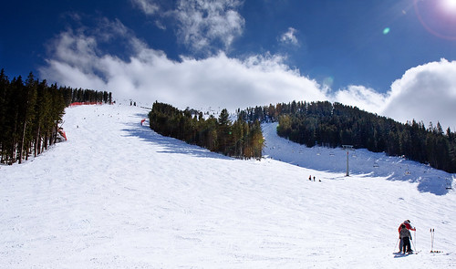 trees sky people sun snow ski clouds lens geotagged skiing bulgaria flare slope skislope bansko img3551 1755mm canon40d