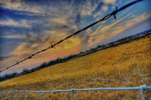 barbed wire sunset by Jhawk