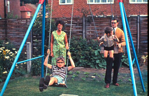 David and Michael on the swings in Darlington
