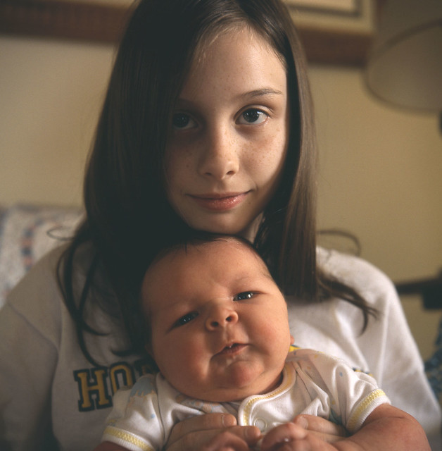 My Daughter holding my newborn Son