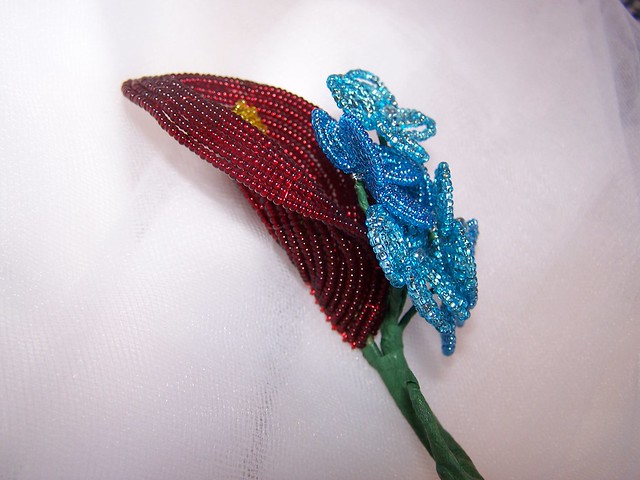 Red Calla Lily and Blue Hydrangea Corsage/Bout. - side view