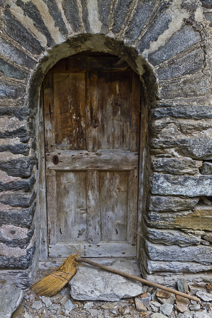 Old broom and door