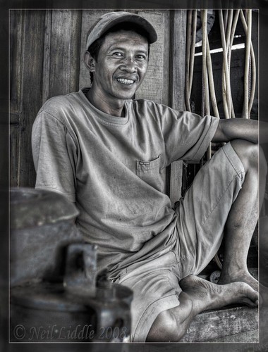 poverty portrait people bw smile shop pose indonesia relax sharp relaxed 2008 sulawesi hdr tyre neils layback mutedcolours mywinners specialtouch platinumphoto rtwoverland timbalban