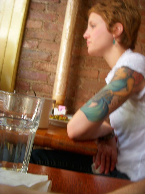 tatooed arm, diner customer