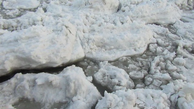 Water flowing under the ice and snow
