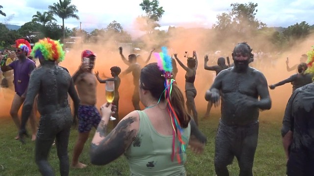 Participants in Orange Smoke, Bloco da Lama (Mud Carnival Party), Jabaquara Beach, Paraty, Brazil (Movie)