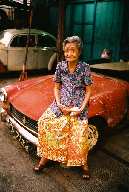 A grandma & an old rusty car