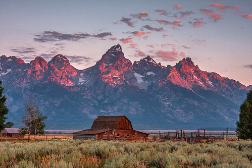 sunrise grand teton national park happybirthdaynps mormon row barn landscape mountains wyoming usa canon 40d photo copyright 2008 jeff sullivan allrightsreserved blueribbonwinner mywinner impressedbeauty anawesomeshot travel roadtrip nomadic photographer visitwyoming hdr moultonbarn alpenglow mormonrow dawn grandtetonnationalpark nature photography unitedstates jeffsullivan weather clear day photomatix hdrsoft photomatixpro top140