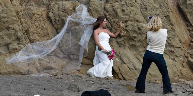 2 of 4 Female wedding photographer on Morro Strand State Beach, Morro Bay, CA