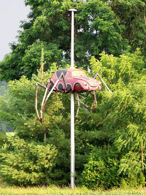 Another view of the Volkswagen-Beetle-spider on a pole