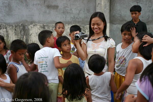 Arlene Surrounded by Children in Diamond Subdivision