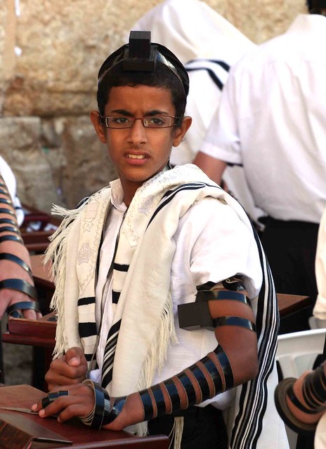 A young boy wearring his phylacteries (Tefillin), for the …