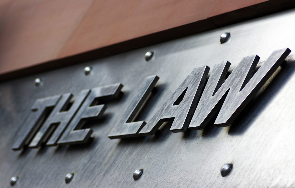 a sign that says law law - The Law