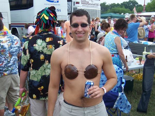 Carlos wears a coconut bra like only a real man can