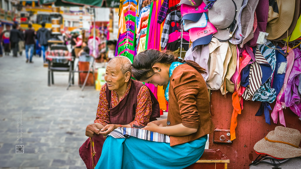 Tibet, candid shot of an old woman and a lady sitting at their street shop (Lhasa, China), 06-2016, 91 (Vlad Meytin, vladsm.com)