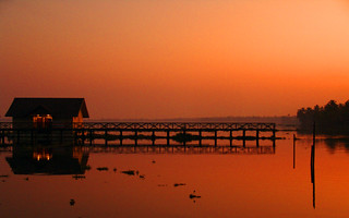 Sunset view of the floating cottages in Cherthala