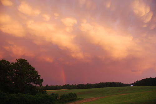 sunset storm clouds rainbow pasture