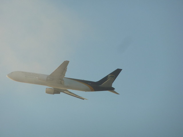 UPS Boeing 767-34AF(ER) cargo jet  N-315UP climbing into the clouds above LAX