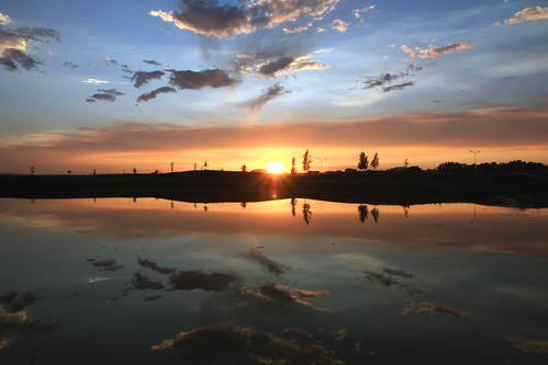 No Cattail Sunset by M@ Kadlick, sunset lake reflection clouds flare