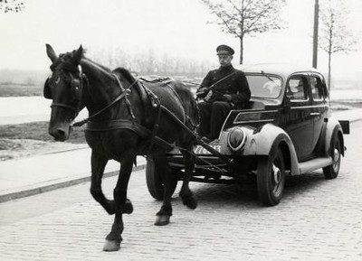 horse pulling a car