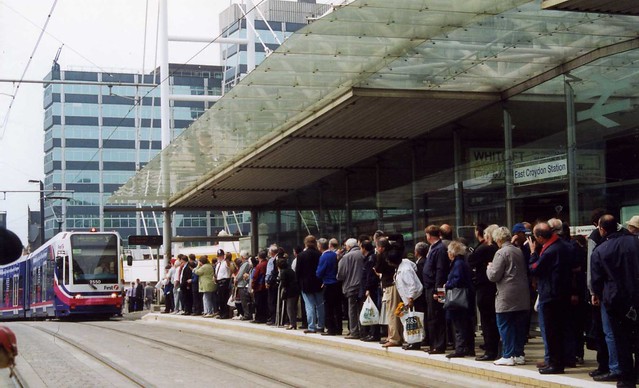 Tramlink first day - East Croydon 10 May 2000. Tramspotters waiting the first tram.  First nr 2550 appears