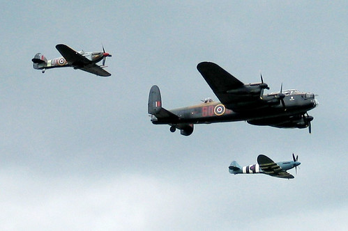 Farnborough Airshow 2008 World War II Aircraft: Avro Lancaster bomber accompanied by Spitfire and Hurricane fighter planes