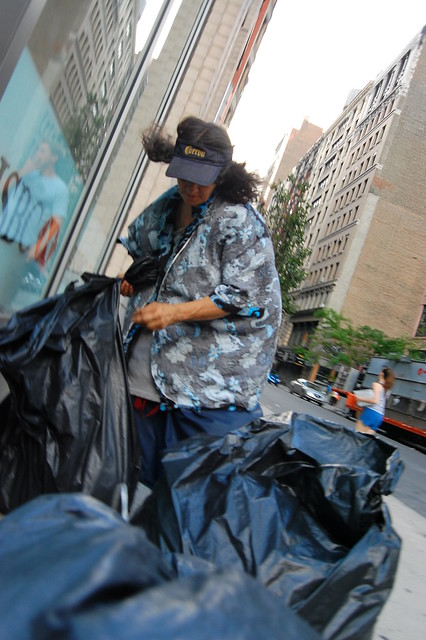 This was certainly a homeless woman with an army of HUGE garbage bags she was collecting cans and assorted things in. I took this picture without looking through the view finder. In this photo she actually begins to take on the appearance of a Plastic bag