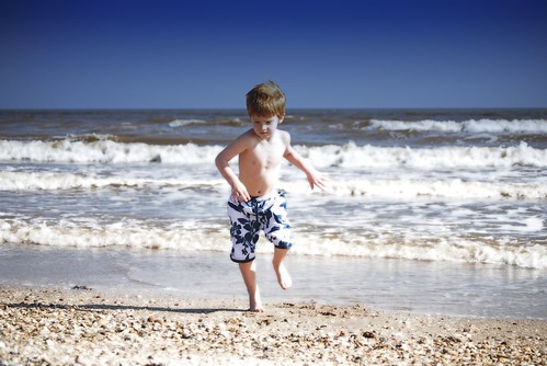 ocean boy sun shells playing beach boys water kids swimming kid sand nikon texas child tx running jordan sargent d40x