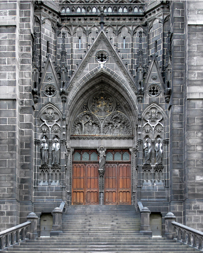 Main entrance of the Cathedral, builded in volcanic stone, of Clermont Ferrand, Auvergne, France