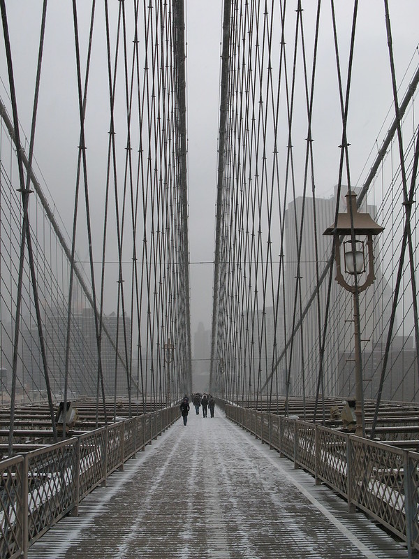 On the Brooklyn Bridge with light snow accumulation