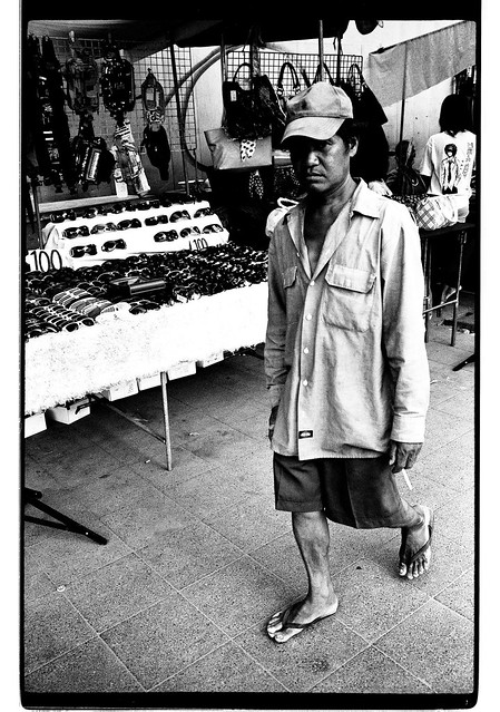 a man alone in the street with his cap - Bangkok, city of angels