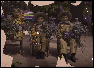 Three boys in western costumes holding flowers | by George Eastman Museum