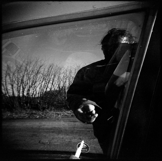 the high art of self portraiture in the window of a parking car (1)