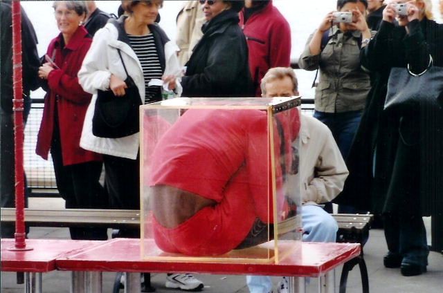 the old guy in red in a box trick
