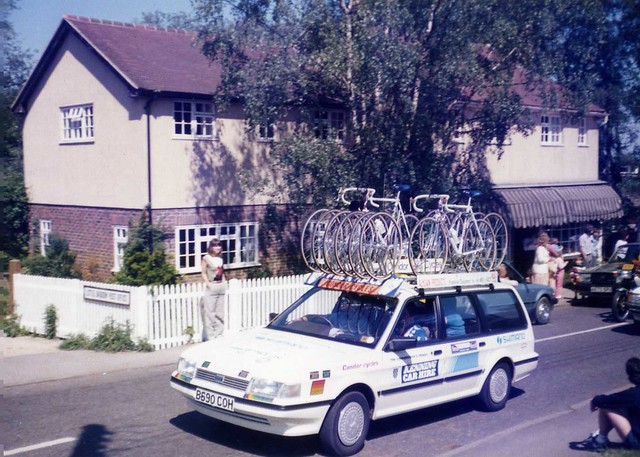 The Milk Race Condor cycles Montego team car climbs past Little Baddow Post Office, 1985