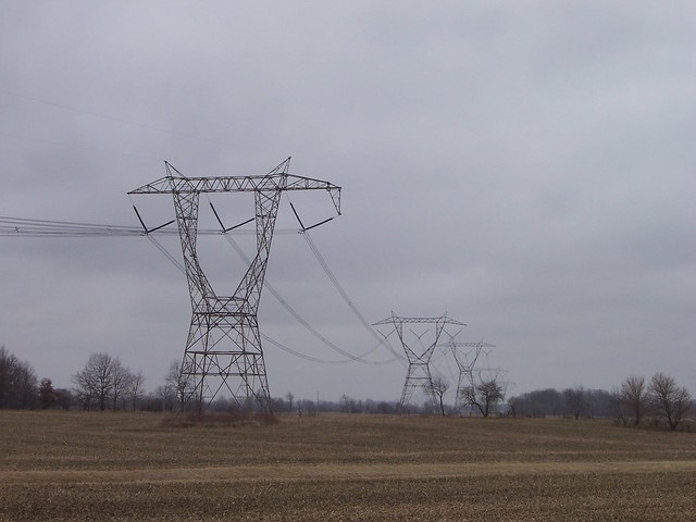 Row of Power Line Structures Receding into the Distance