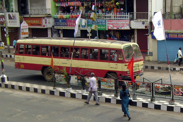 An old KSRTC Thiruananthapuram (Trivandrum) city bus stops at traffic lights...