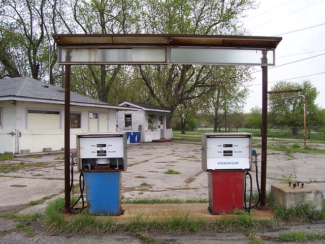 Abandoned Red and Blue Gas Pumps