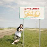 Welcome to South Dakota! Here&#039;s me, in front of the South Dakota line, as part of my 50 States project!