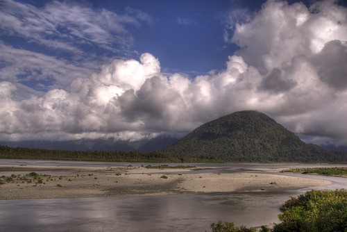 haast river nz 200901 westcoast southisland newzealand landscape nature clouds blue sky water trees hills searchthebest explore 169x5