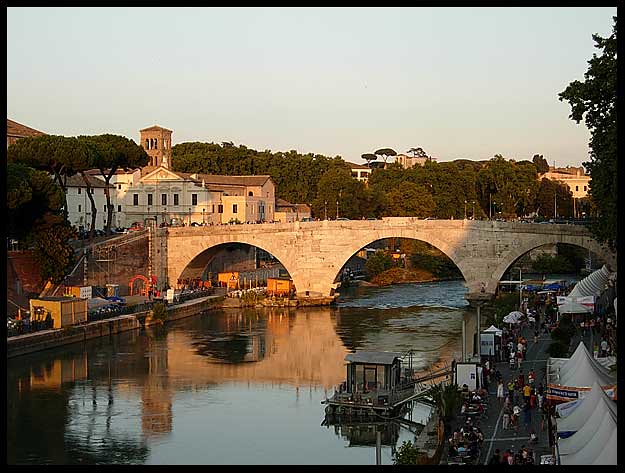 A view down the Tiber River to Ponte Cestia during the day in central Rome, Italy.  15-08-2007.